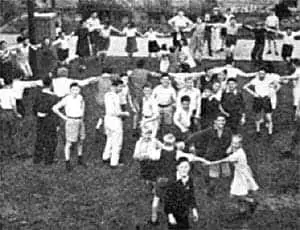 Photograph of survivors dancing a hora.