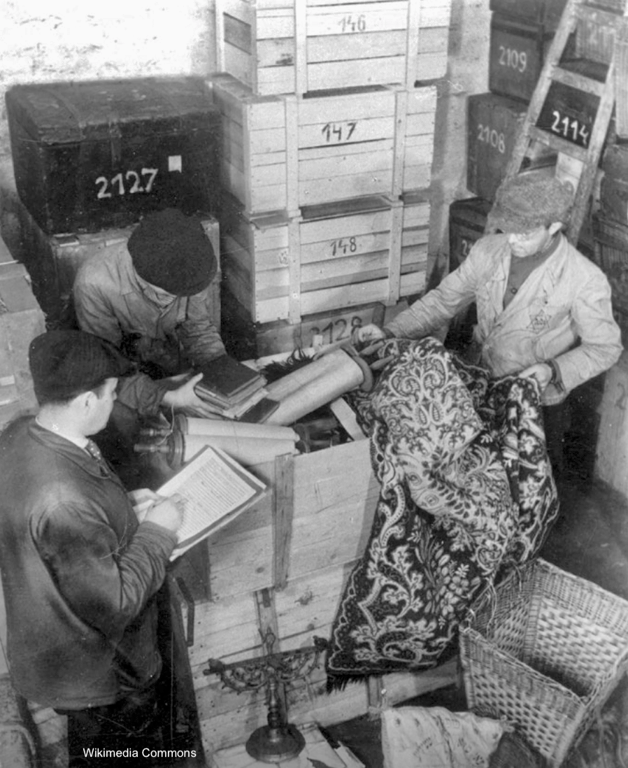 Photograph of Sorting goods confiscated from Jews from the regions in Prague 1943
