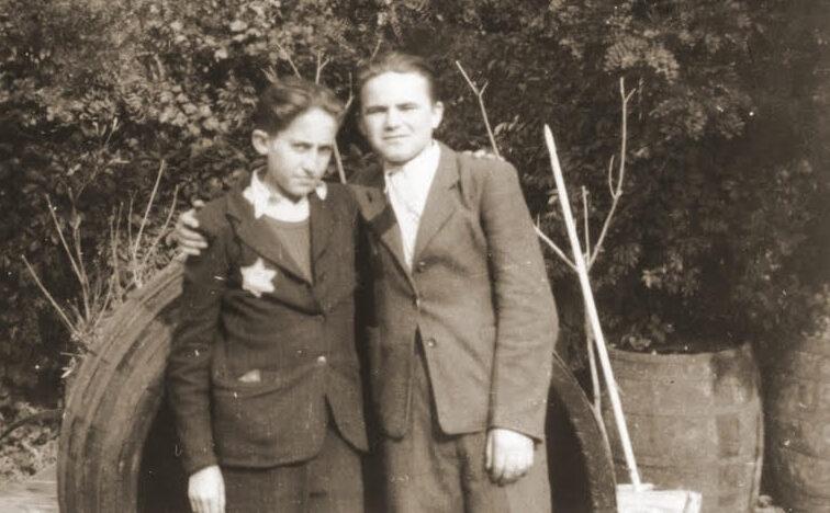 Photograph of Michael Blain (right) poses with his cousin Hershi wearing the yellow star. Budapest, Hungary, 1944.