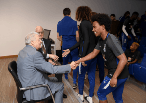 Photograph of Harry Spiro meeting footballers at Chelsea FC, 2018.