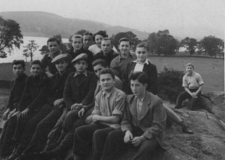Photograph of Harry Spiro (Front row second to right). Howard Chandler (in background).