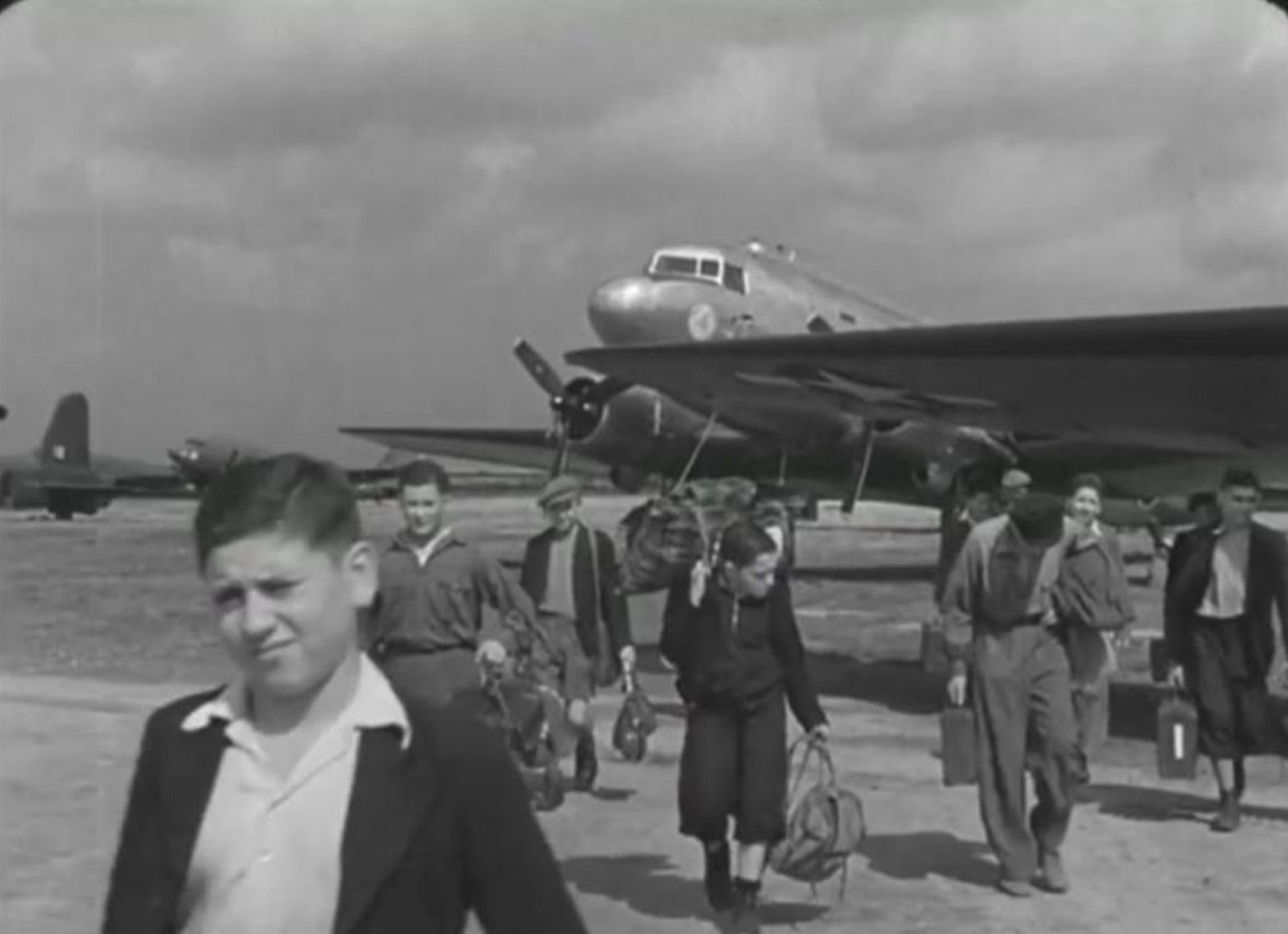 Photograph of The first group of the Boys arriving at Crosby-on-Eden airport in August 1945.