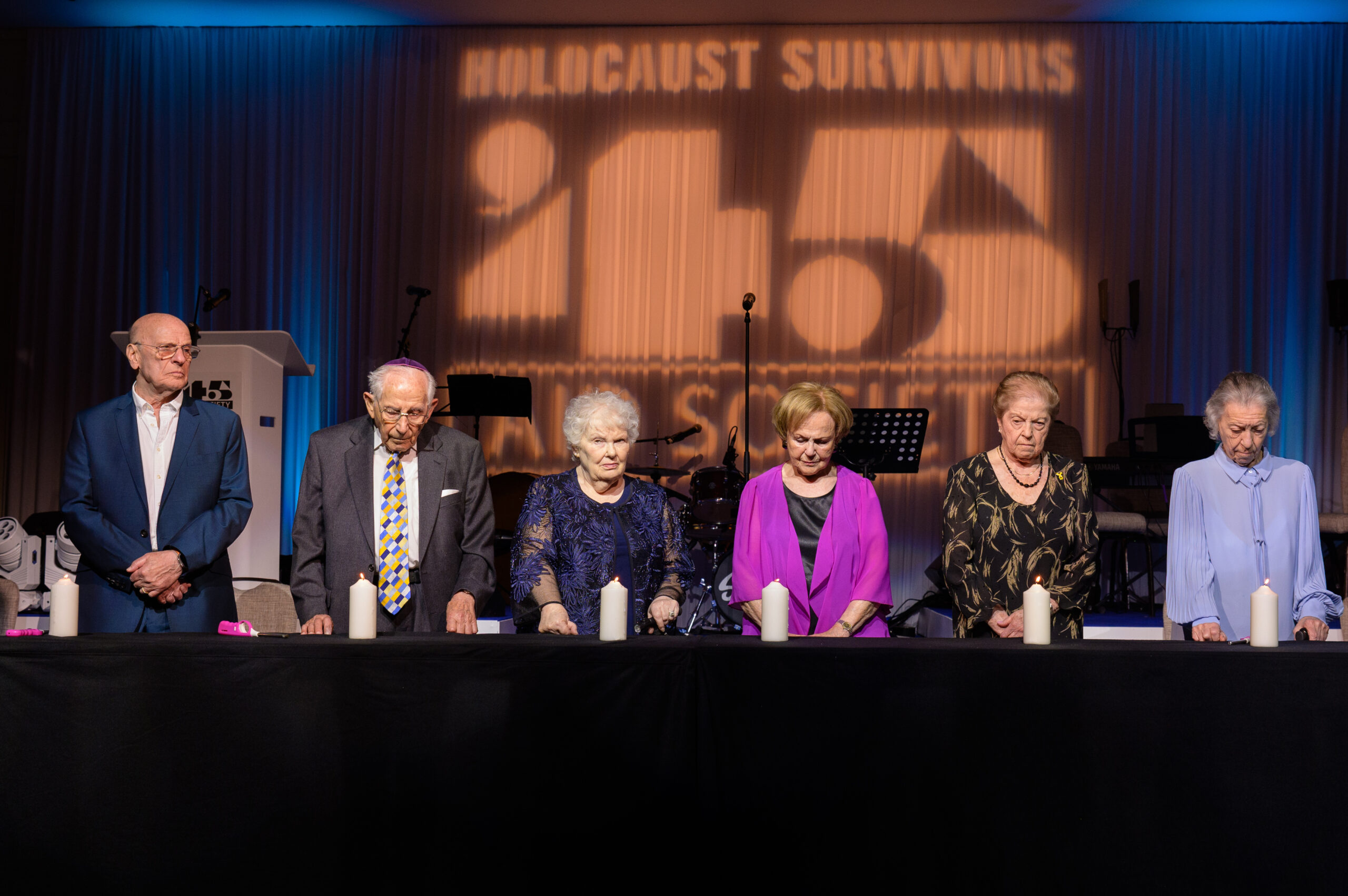 Photograph of commemorative candle lighting at the 2024 '45 Aid Society Annual Commemoration Dinner, London, UK.