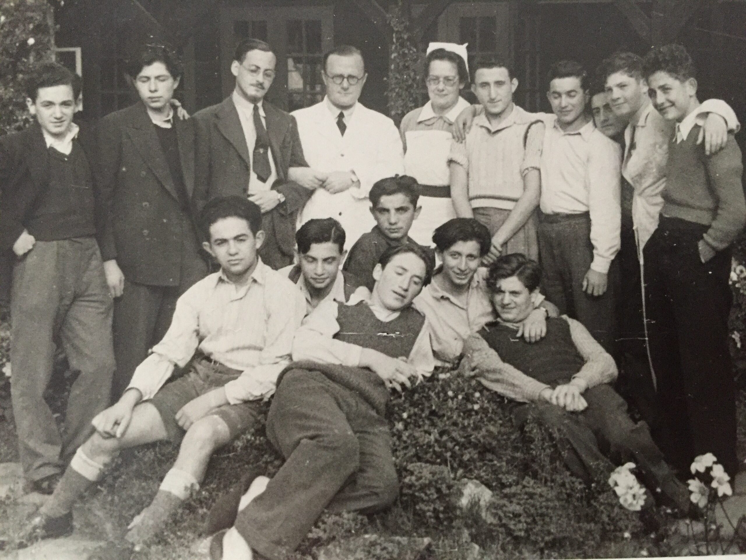 Photograph of 4th from left, Dr Yellin and Sister Maria. Meir Stern, centre back, Frank Farkas. Right sitting leaning, Michael Novice with friends. Ashford Kent, 1946
