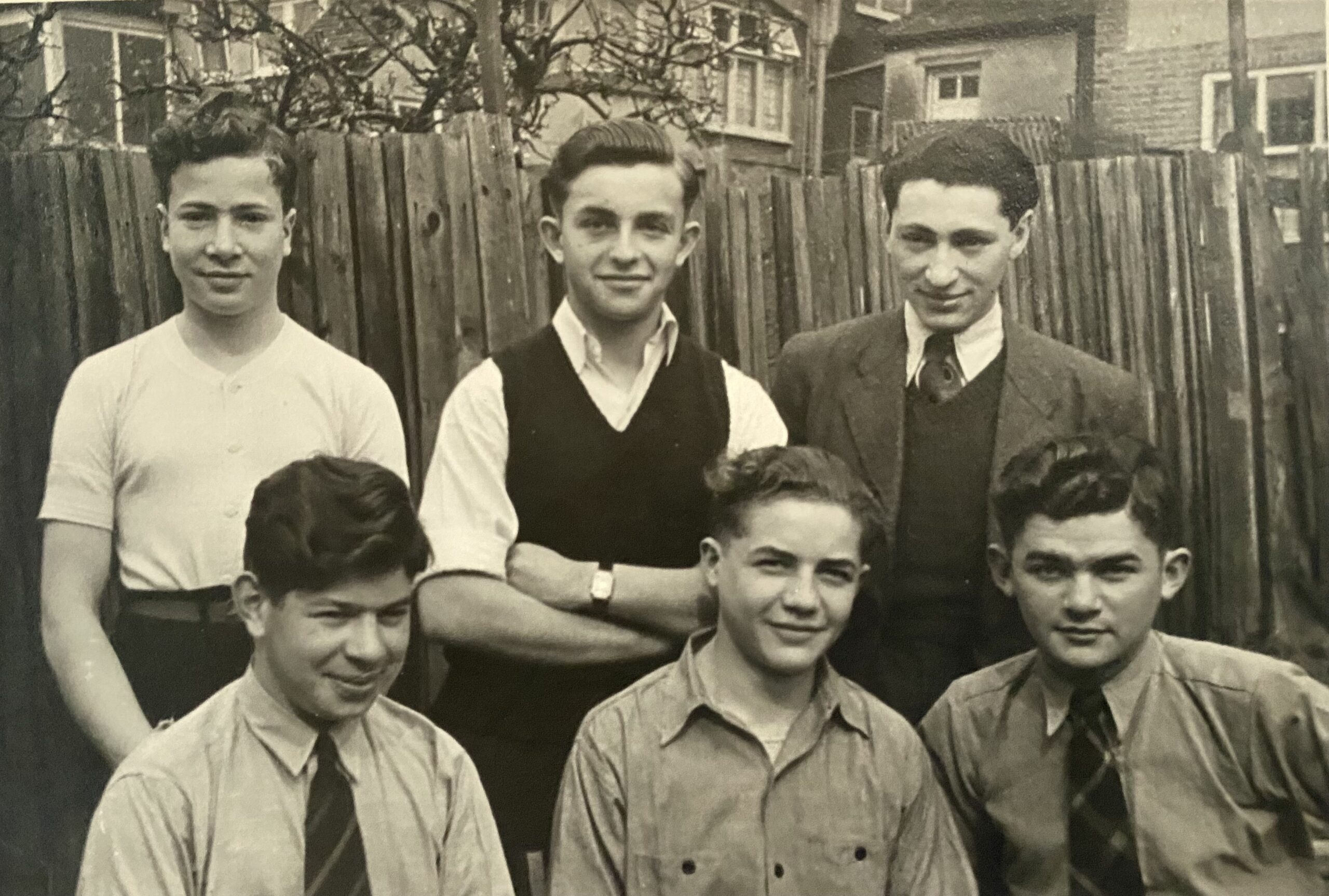 Photograph of Alec Ward,front right at Finchely Road Hostel, together with friends