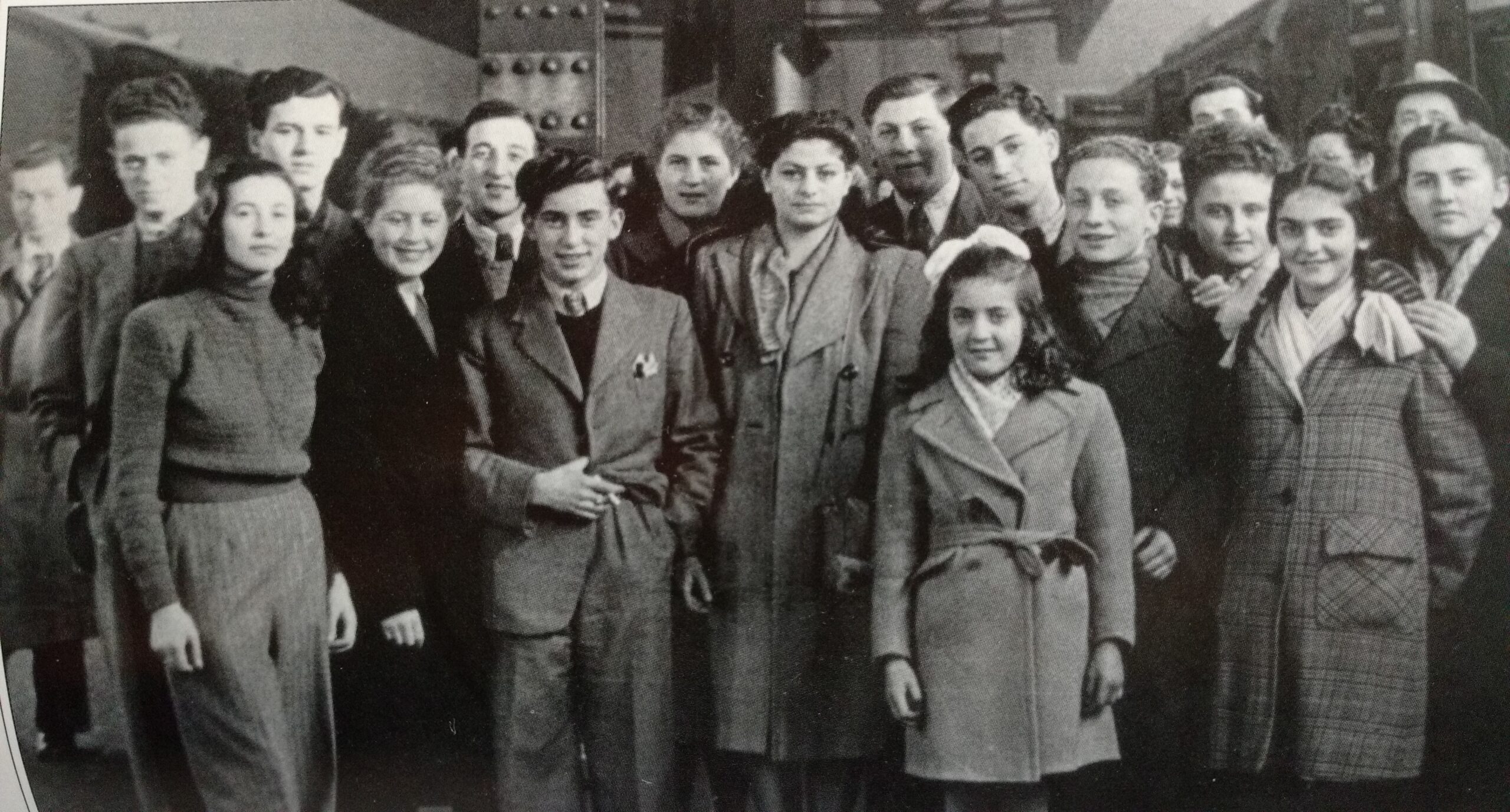Photograph of Vera Waldman (nee Stern)’s mother is tall girl in centre Arnold Friedman is on her right. Emil Newman far left in background. On their way to Canada